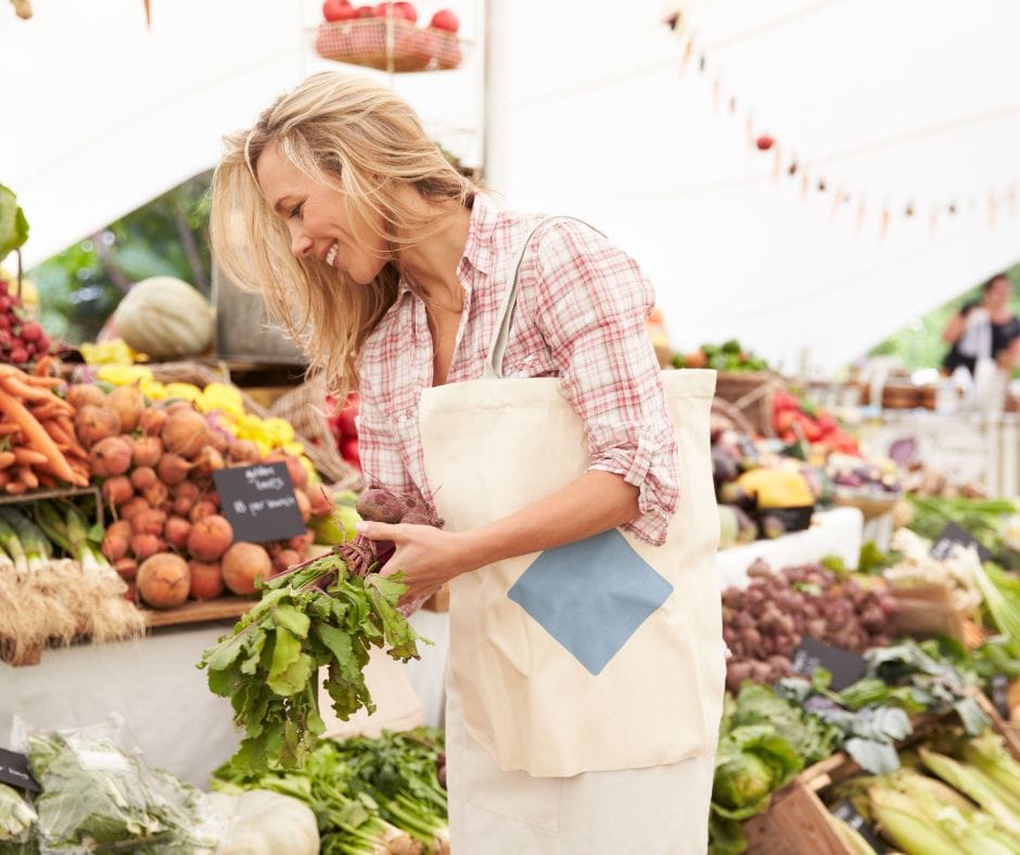 woman enjoying the benefits of farmers markets