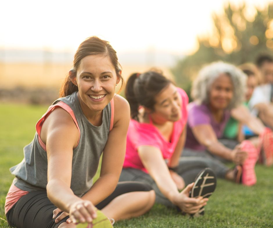Woman performing warm-up and stretching exercises before a workout