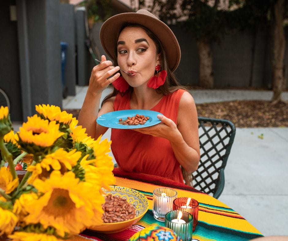 A woman eating beans