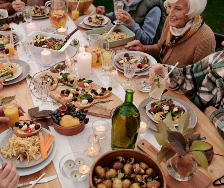 Family and friend enjoying Mediterranean diet benefits.